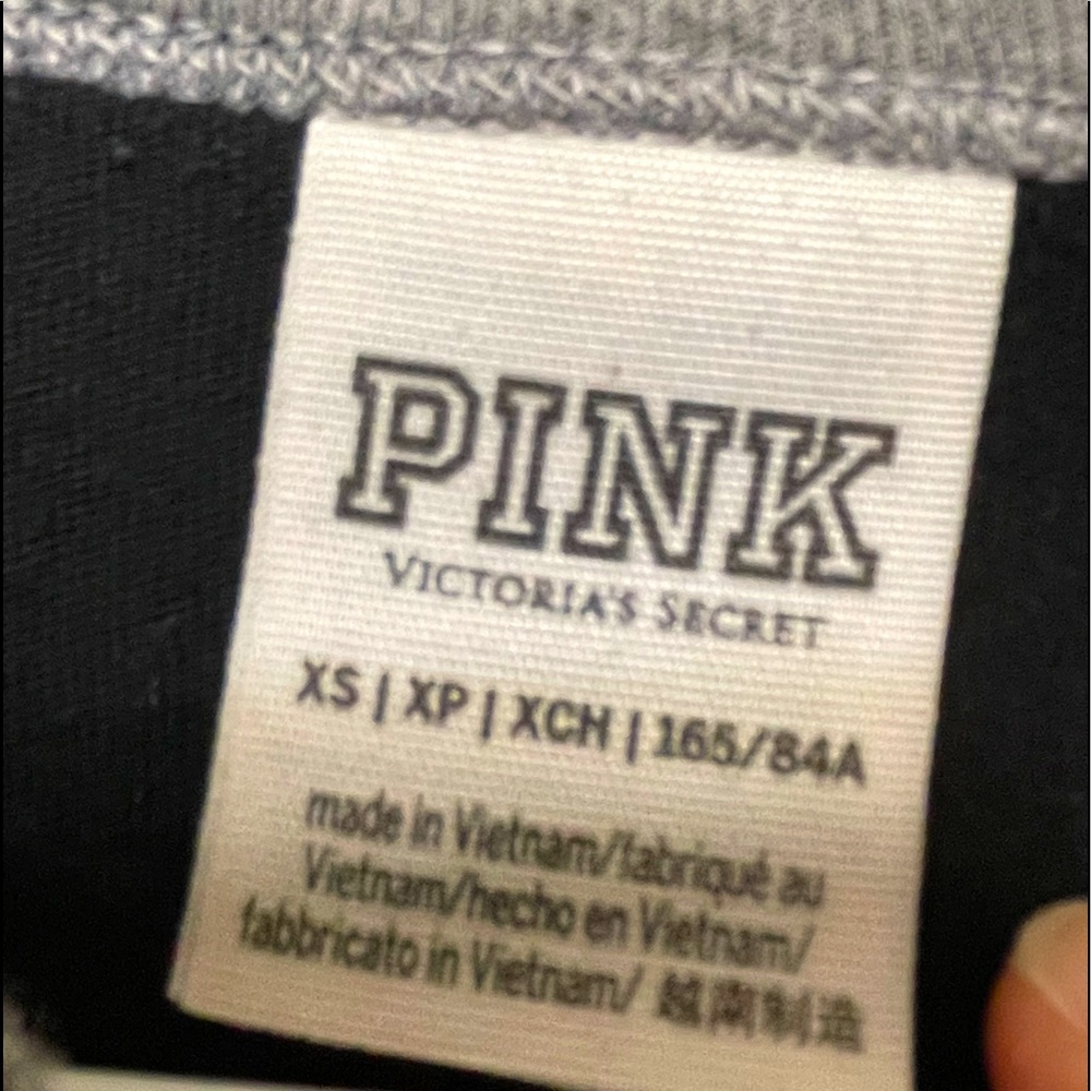 Pink Victorias Secret black top, Sparkly back. Like new .